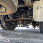 2005 Hino Ranger Tray Back Truck with Crane undercarriage showing air bag suspension