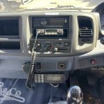 2004 Hino 500 FD Fridge Truck interior dash showing UHF, aftermarket stereo, ThermoKing control panel